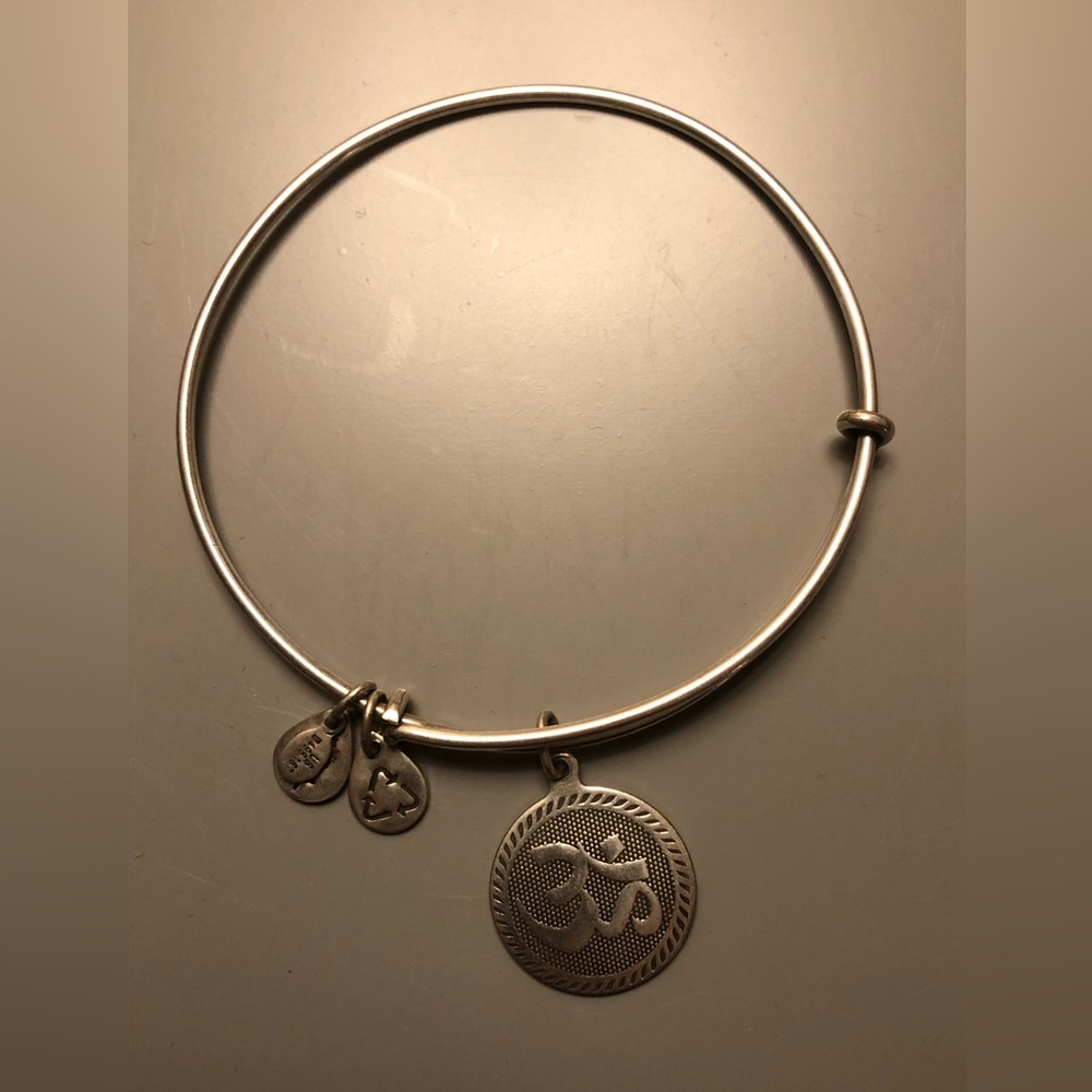 Alex and Ani silver OHM adjustable bangle. Looks great worn in a “stack”